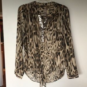 Sheer blouse with tie waist.